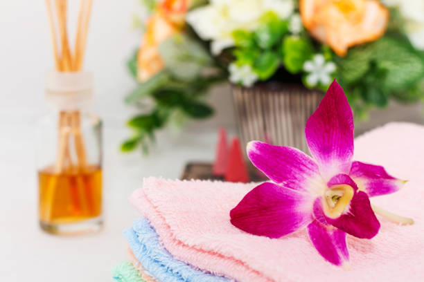 spa aroma therapy with orchid flower on towel