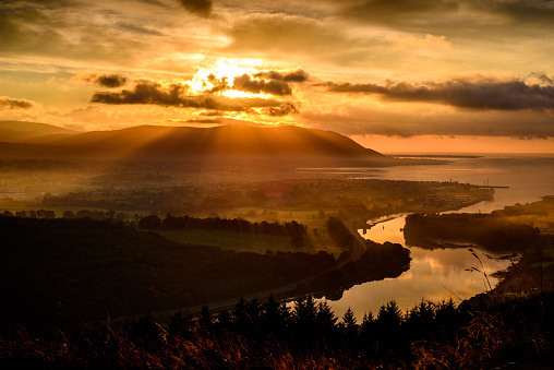 Early in the morning the Sun is already scanning the countryside looking for places to warm up after a cold night, Warrenpoint, Mourne Mountains, County Down, Northern Ireland.