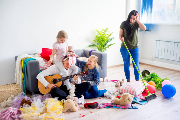 istock Mother cleaning mess at home 803273756