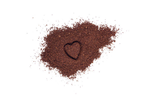 istock Ground coffee with heart shape isolated on a white background 803274584