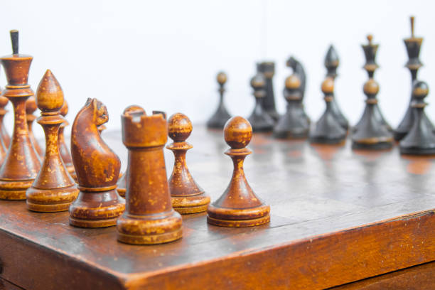 istock Old chess Board with wooden pieces. 803279468