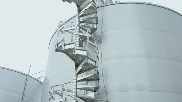istock Factory. Metal staircase to storage tank 803284954