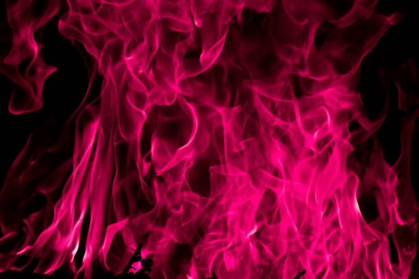 istock Blazing pink fire flame background and textured 803285506