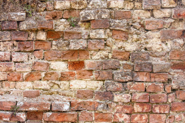 istock Old red weathered brick wall, horizontal grunge background 803288142
