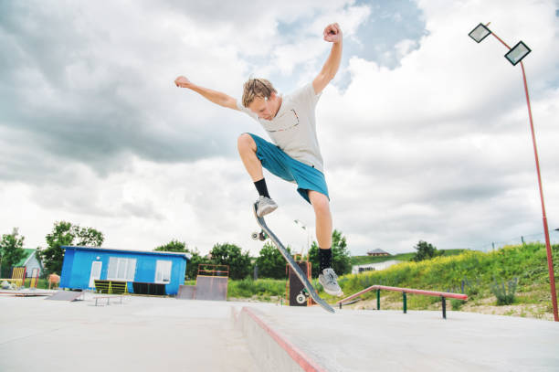 istock A boy in a skate park doing a trick on a skateboard 803291696