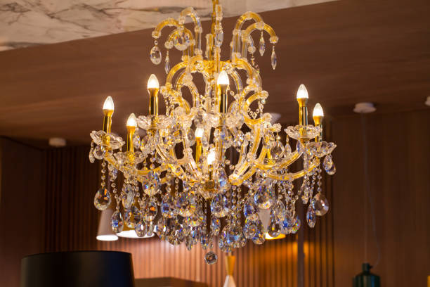 istock Beautiful chandelier. luxury expensive chandelier hanging under ceiling 803294574