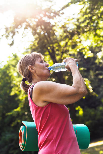 istock Senior woman on yoga class 803295092