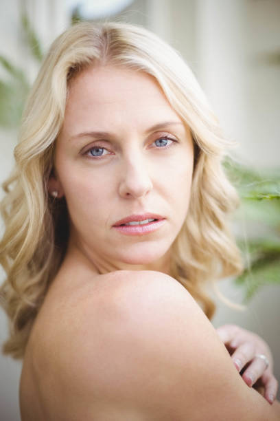 istock Beautiful woman looking at camera 803299586