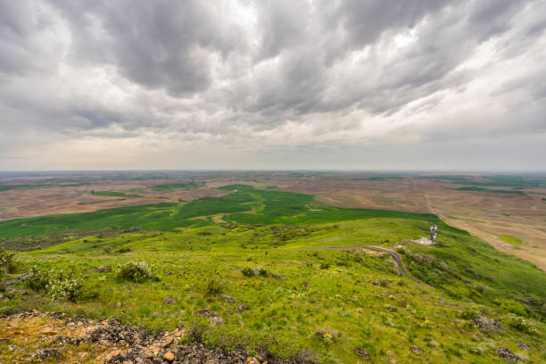 istock Beautiful clouds over green hills. 803300386