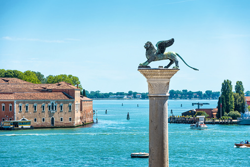 The famous ancient winged lion sculpture on the Piazza San Marco in Venice, Italy. The lion is a symbol of Venice.