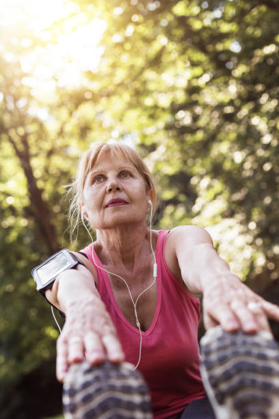 istock Senior woman stretching 803304080