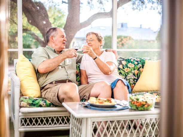 istock Senior couple eating dinner on the veranda 803304246