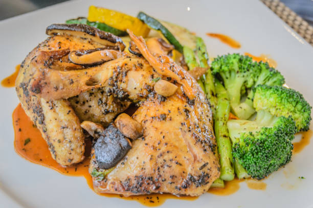 beech oven roasted chicken with lemon and rosemary served with grilled Mediteranean vegetables