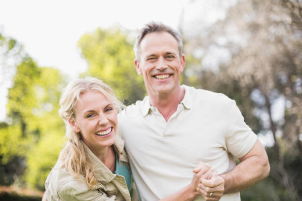 istock Cute couple dancing and holding hands 803331926
