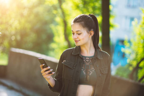 istock women using smart phone in city 803345630