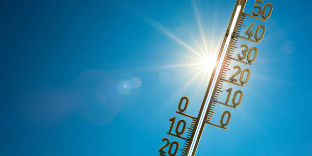 Hot summer Thermometer with bright sun and blue sky heat wave photos stock pictures, royalty-free photos & images