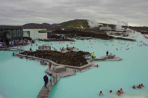 Blue Lagoon, Iceland- 23 august 2014: People bathing in The Blue Lagoon, a geothermal bath resort in the south of Iceland, a 'must see' by tourists.