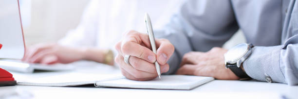 Businessman holding pen in hand