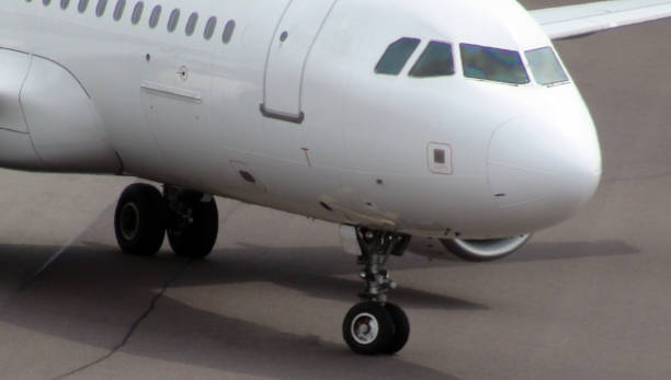 istock Scene Of Passenger Airplane Taxiing To Loading,Unloading Gate For Disembarkation After Arrival At Airport 803363650