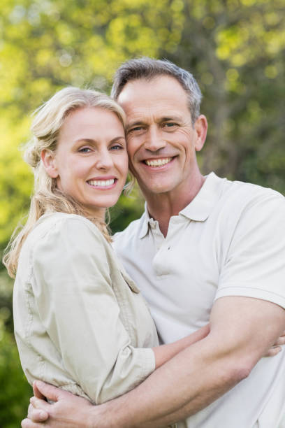 istock Cute couple hugging with arms around 803382510