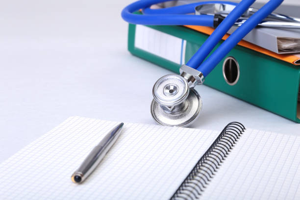 istock Folder file, stethoscope and RX prescription on the desk. blurred background. 803392202