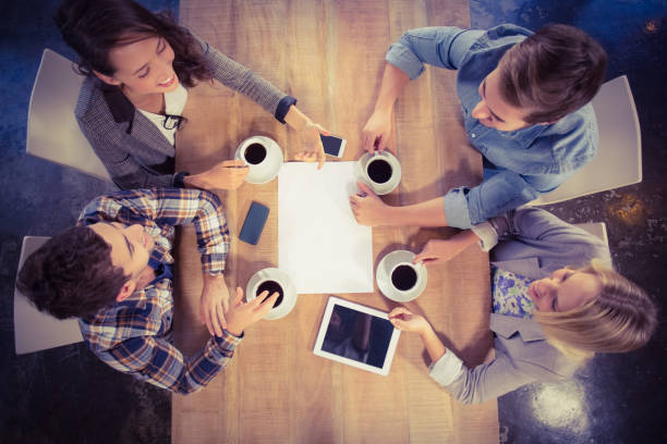 istock Smiling friends chatting and drinking coffee 803420500