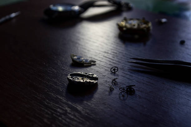 istock A watch maker is repairing a vintage automatic watch. 803435100