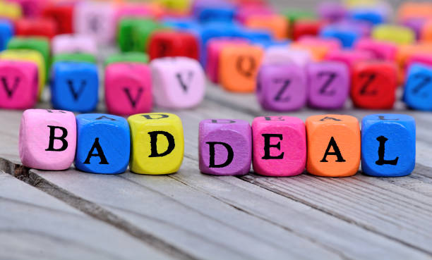 istock Bad deal words on table 803446060