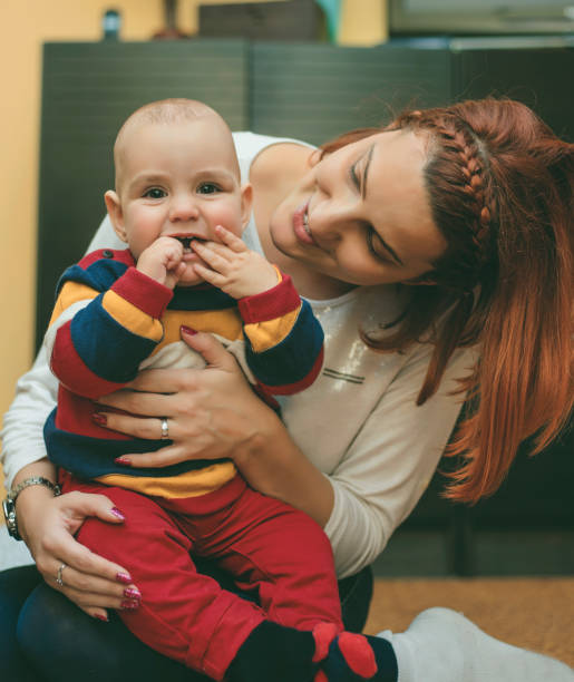 istock Adorable young mother with baby boy 803454384