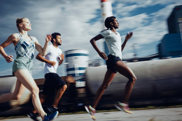 istock Joggers running outdoors 803454398