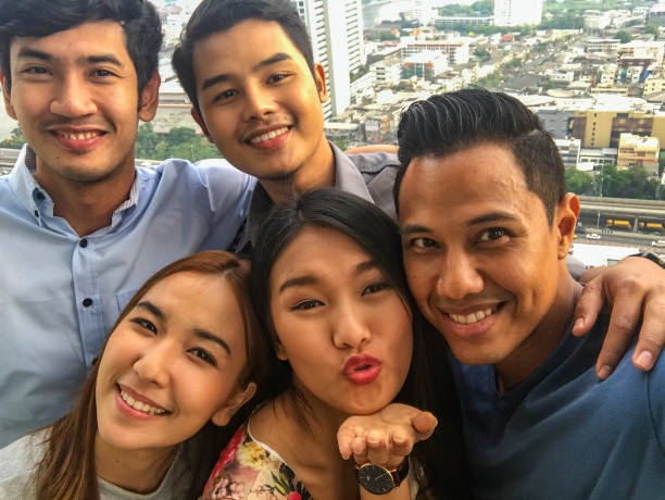 istock Asian Group of Friends Taking a Selfie 803462176