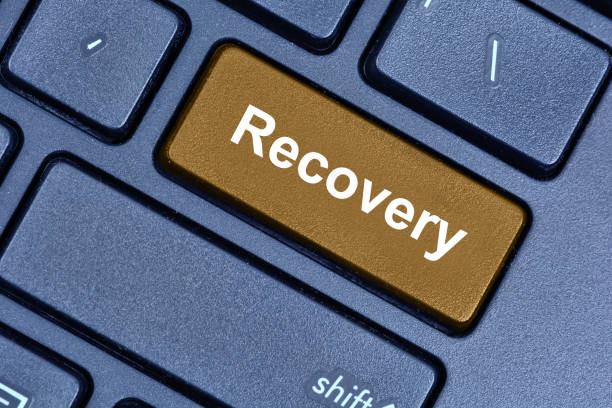 Recovery word on computer keyboard stock photo