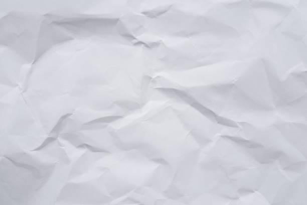 istock White crumpled paper background and texture 803468836