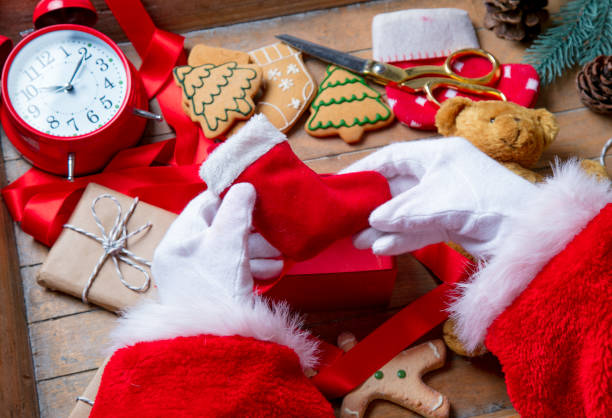 istock Santa Claus have wrapping a Christmas sock 803469178