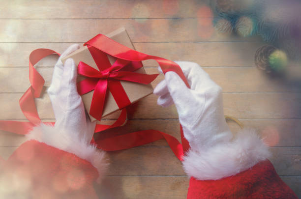 istock Santa Claus have wrapping a Christmas box 803469192