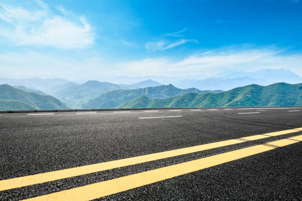 istock asphalt road and mountain background 803469258