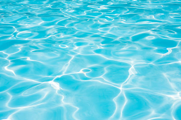 istock Beautiful ripple wave and blue water surface in swimming pool 803473556