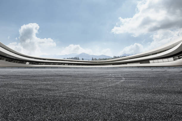 istock asphalt road and modern architecture under the blue sky 803473814