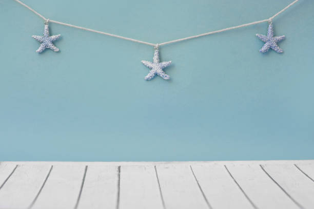 istock Seastars on the fishing net on a blue background 803479520