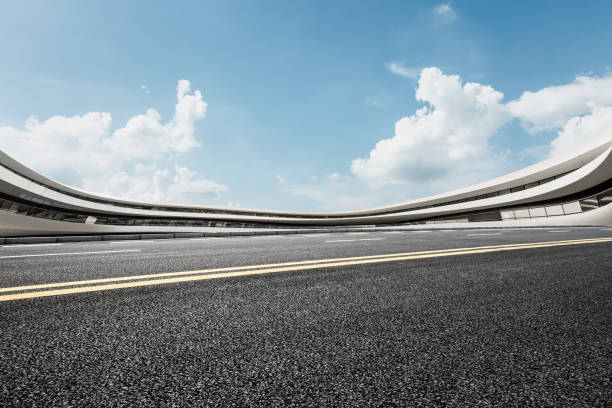 istock asphalt road and modern architecture under the blue sky 803479704