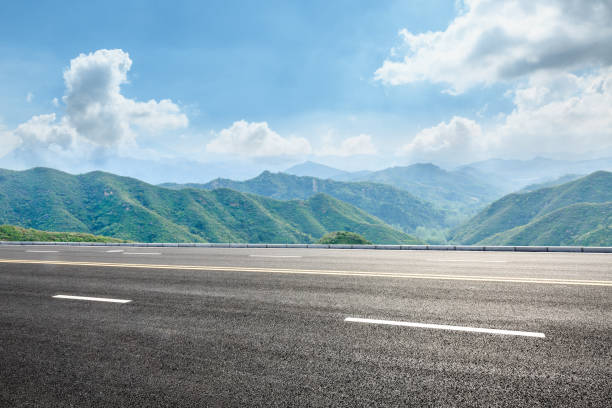 istock asphalt road and mountain background 803482650