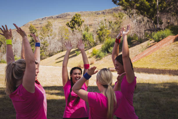 istock Group of women interacting with each other in the boot camp 803483194