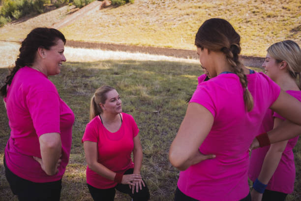 istock Group of women interacting with each other in the boot camp 803483282
