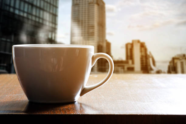 istock Cup of coffee on wooden table in cafe 803488512
