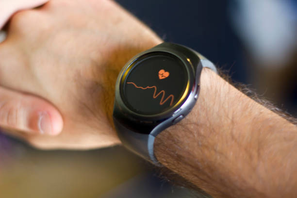 istock Man measuring heart beat in smartwatch 803494236