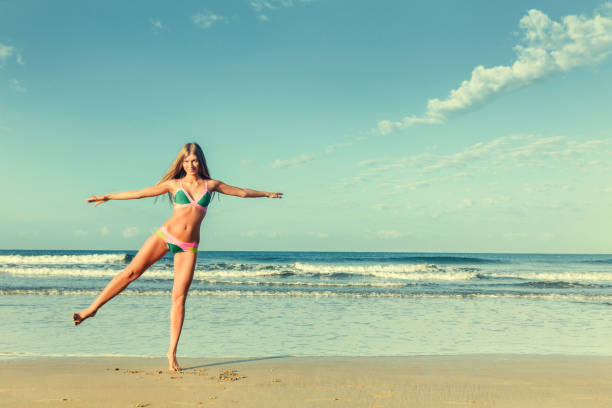 istock Woman at sea beach 803497020
