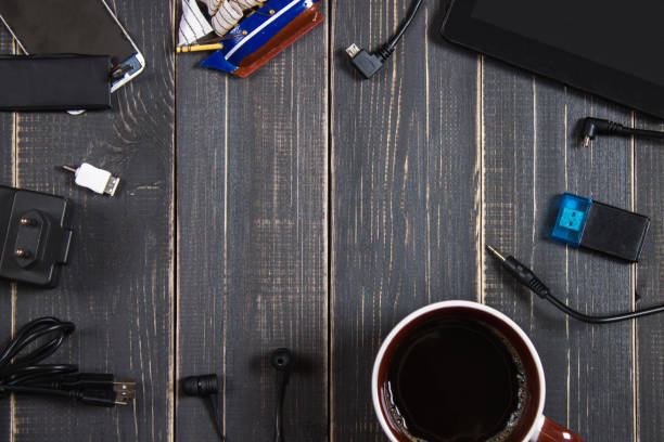 istock Electronic devices and elements on a dark wooden background. Place for the text. A concept for Father's Day. The programmer's desk. Hobby. 803506392