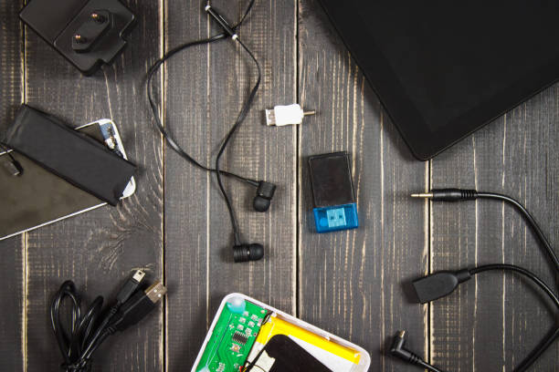 istock Electronic devices and elements on a dark wooden background. Place for the text. A concept for Father's Day. The programmer's desk. Hobby. 803506428