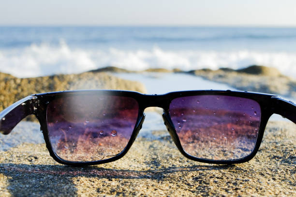 istock Sunglasses at sea background 803531652