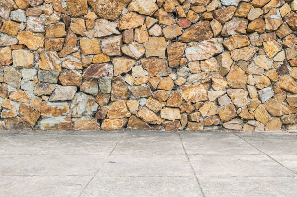 istock Closeup surface brick pattern at old stone brick wall and cement floor textured background 803558998